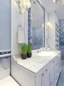 Provence blue bathroom trend. Bathroom furniture in white. A large mirror with mosaic frame of blue, white mixer sink consoles. 3D render